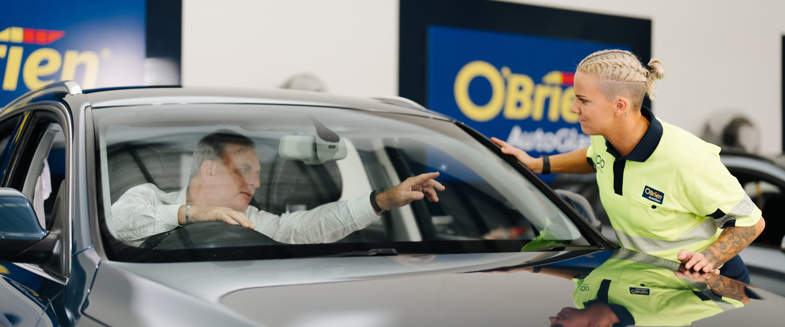O'Brien technician inspecting a windscreen chip